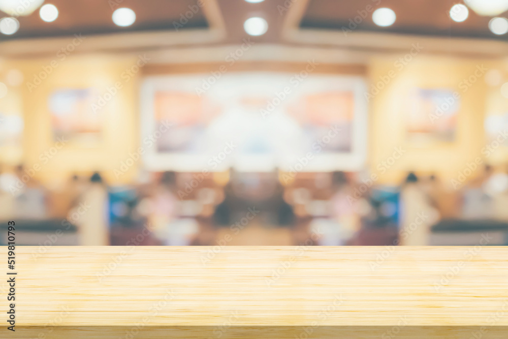 Empty wood table top with cafe restaurant interior blurred background Empty wood table top with cafe restaurant interior blurred background