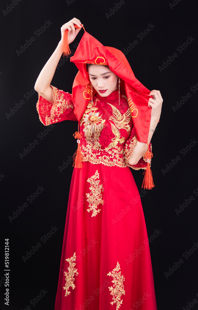 A woman in a red Traditional Chinese wedding dress A woman in a red Traditional Chinese wedding dress