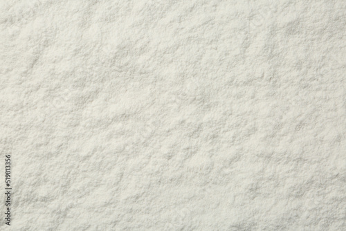 Pile of organic flour as background, top view