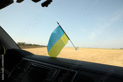 National flag of Ukraine on windshield inside car