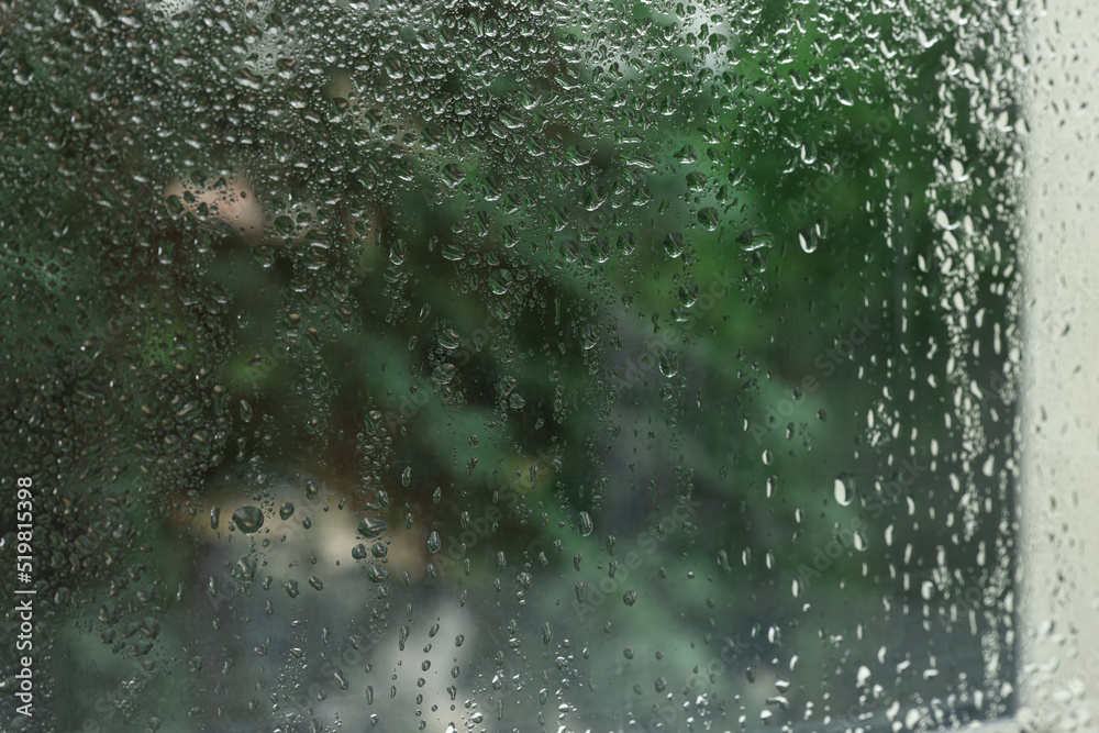 Window glass with water drops as background, closeup Window glass with water drops as background, closeup