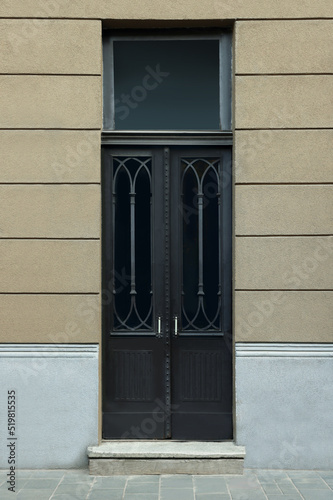 Entrance of house with beautiful black door and transom window