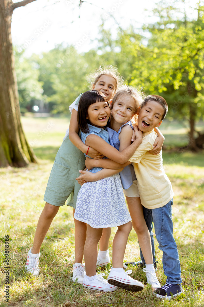 Group of asian and caucasian kids having fun in the park Group of asian and caucasian kids having fun in the park