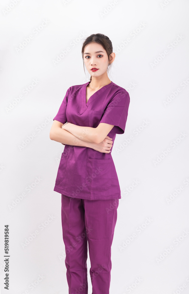A female nurse in a purple uniform A female nurse in a purple uniform