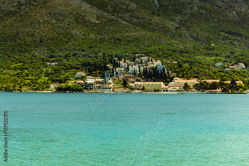 Wallpaper Mural View from the bay to the town of Cavtat in Croatia, June, daytime, the slope of the mountain covered with vegetation. Torontodigital.ca