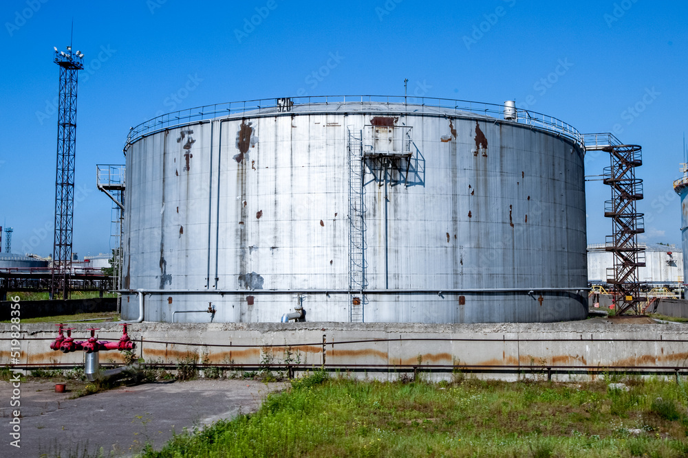 Refinery factory oil storage tank and pipelines. Oil and gas petrochemical industrial background Refinery factory oil storage tank and pipelines. Oil and gas petrochemical industrial background