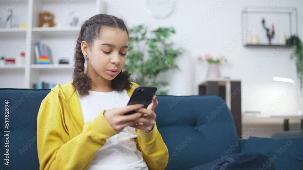 Smiling teenage girl texting with friends, gadget addiction, social networks Smiling teenage girl texting with friends, gadget addiction, social networks