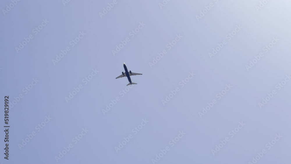 Airplane passing through the sky on its approach to the city airport. Airplane passing through the sky on its approach to the city airport.