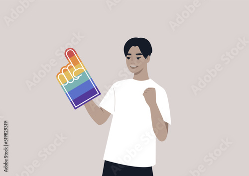 A Pride foam finger colored with rainbow colors, LGBTQ community support