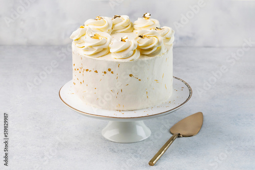 White cake on cake stand on the white background