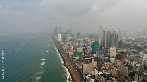 Aerial drone of streets and railway on the coast of the city of Colombo. Sri Lanka.