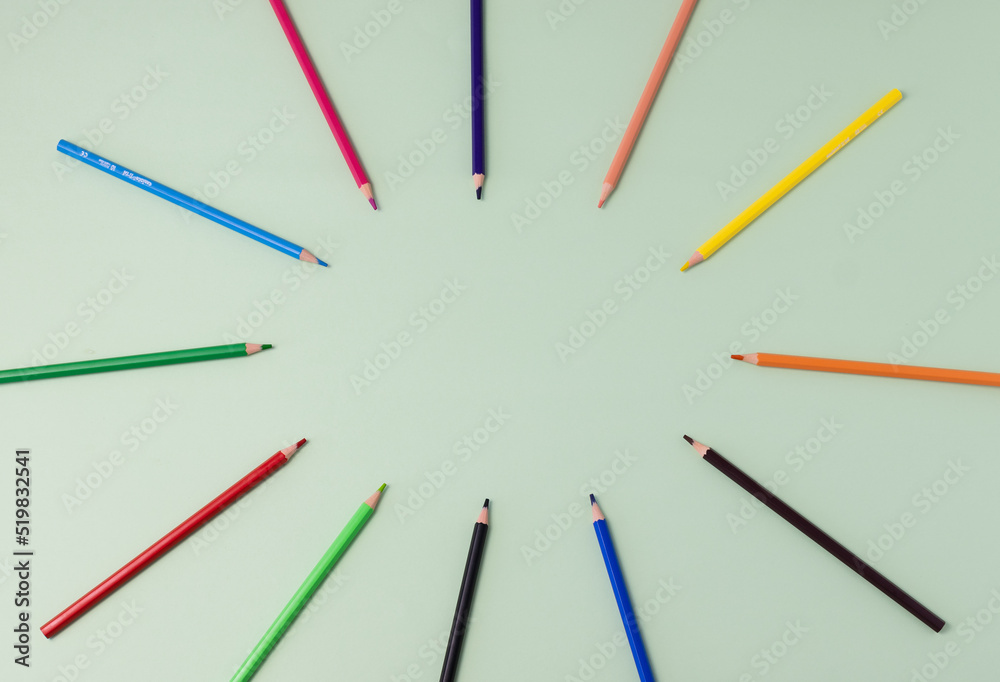 colored pencils on mint green background colored pencils on mint green background