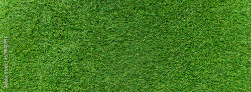 Panorama of green artificial turf flooring texture