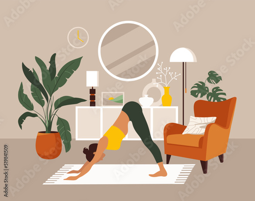 The girl does yoga or aerobics at home.