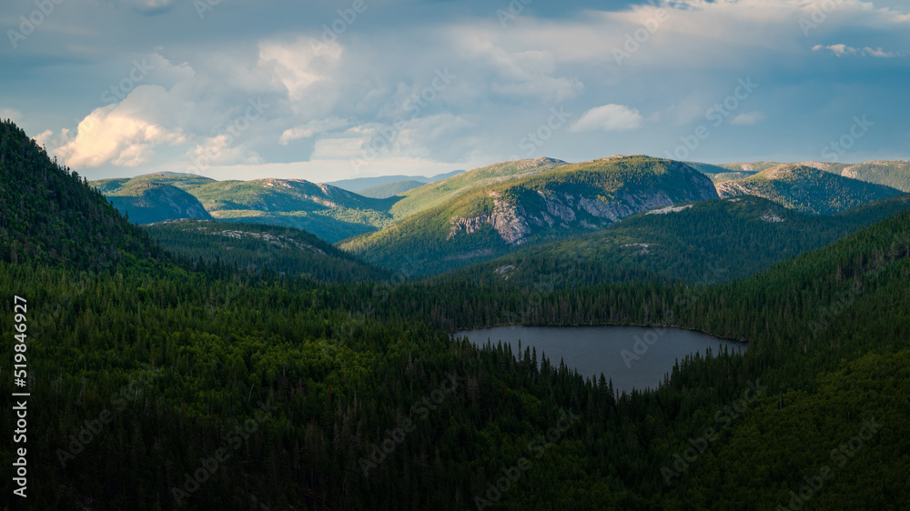 Remnants of sunlight over the mountains in the distance, Charlevoix, QC, Canada