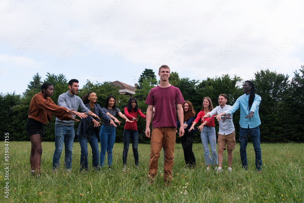 Obraz premium Group of young people cheering to do a flip in the park outdoors