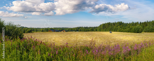 Tractor in the field, dista...