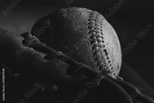 Photography Old used baseball texture close up with glove in dark black and white for sport