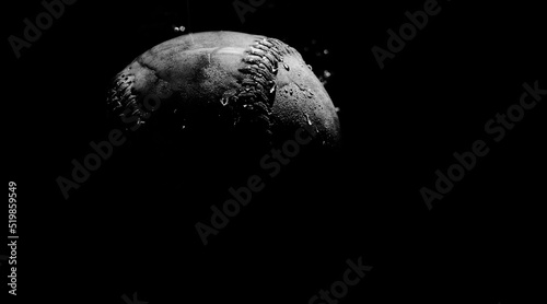 Obraz na plátne Water on old baseball in dark low key lighting close up with copy space on background