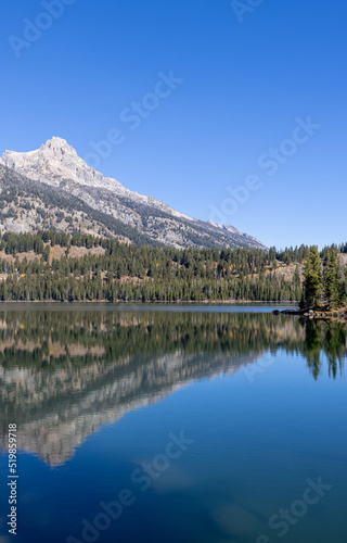 Scenic Reflection Landscape of the Tetons in Taggart Lake in Autumn © natureguy