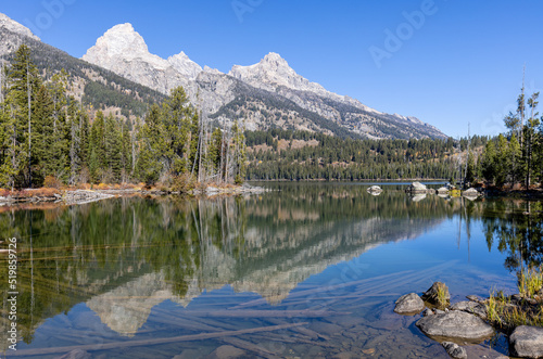 Scenic Reflection Landscape of the Tetons in Taggart Lake in Autumn photo