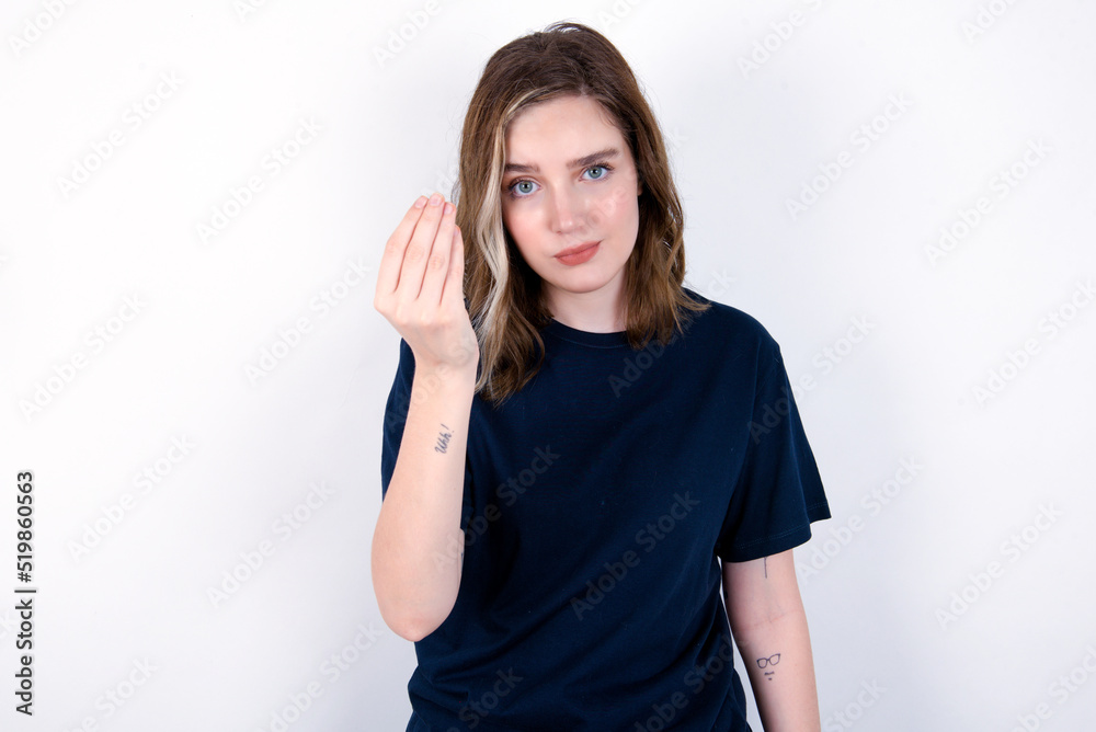 Φωτογραφία young caucasian woman wearing black T-shirt over white background Doing Italian