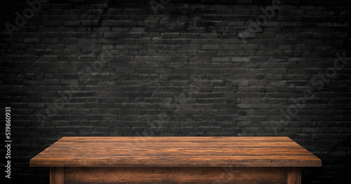 empty wood table on brick wall background