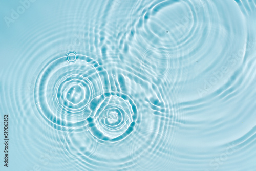 Blue water texture, blue mint water surface with rings and ripples. Spa concept background. Flat lay, copy space.