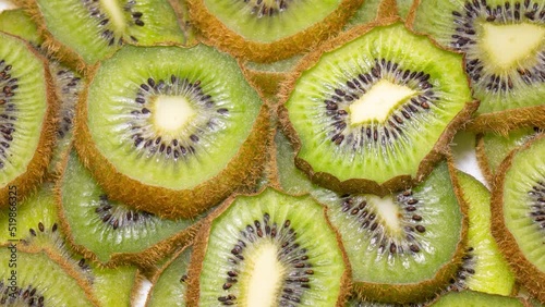 Kiwi slices becomes dry and wrinkled. Fruit dehydrates quickly. Fast timelapse. Concept of aging, time, health, skincare, cosmetic care.