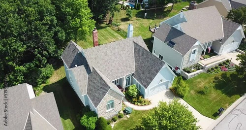 Drone Orbiting Away from New Patterned Roof in the Suburbs