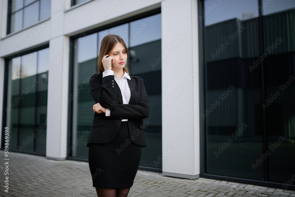 Portrait of a business woman outside making a decision, contemplating, serious. The concept of doubt. Portrait of a business woman outside making a decision, contemplating, serious. The concept of doubt.