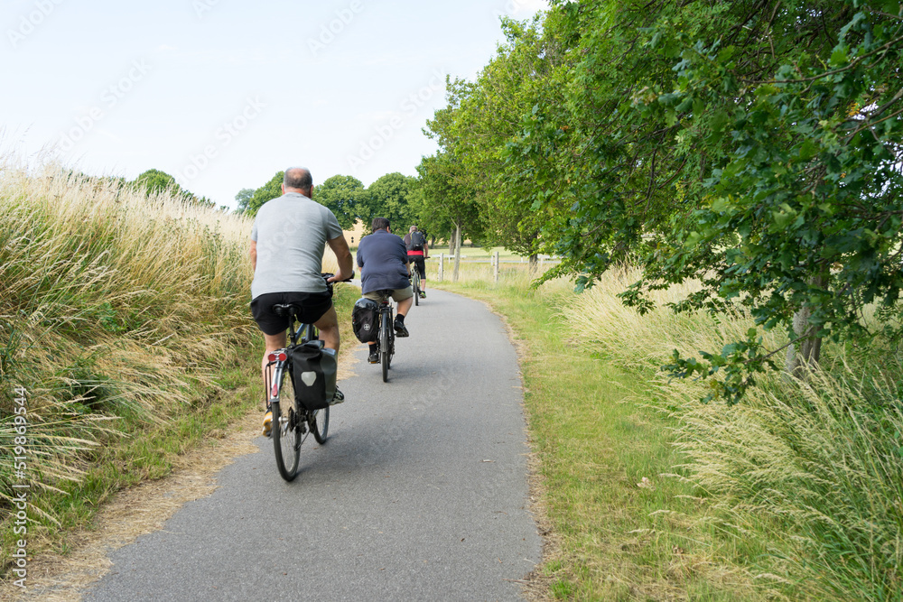 Naklejka premium Outdoor activities in Mecklenburg Western Pomerania, actively organize holidays. Cycling trough the beautiful landscape in summer time on quiet country roads with wonderful views 