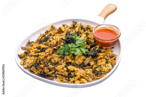 Vegan truffle orh luak chilli sauce served in a dish isolated on plain white background side view of Orh Luak Carrot Cake photo