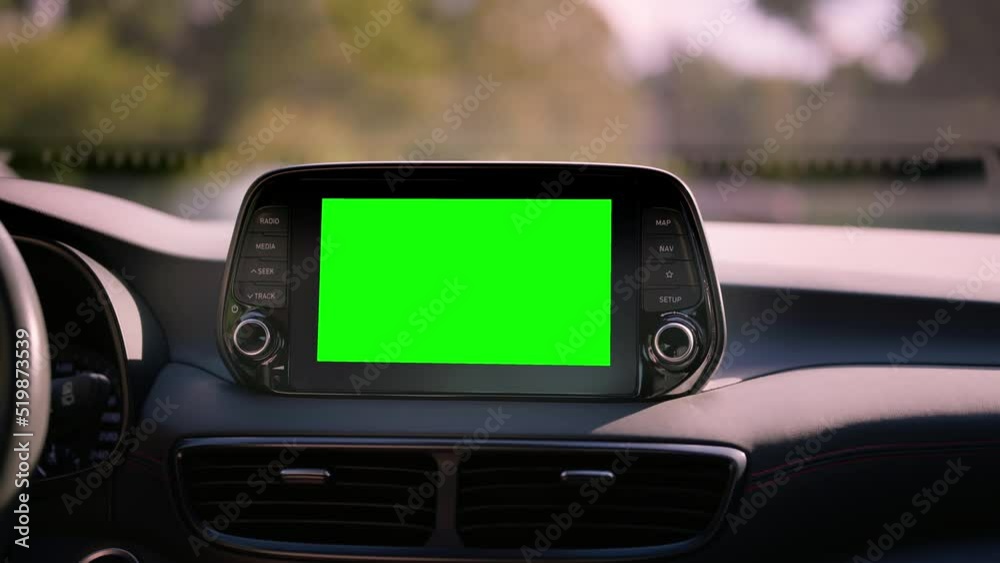 Close up display with green screen on car panel, car driving with navigation concept, blank screen dashboard.