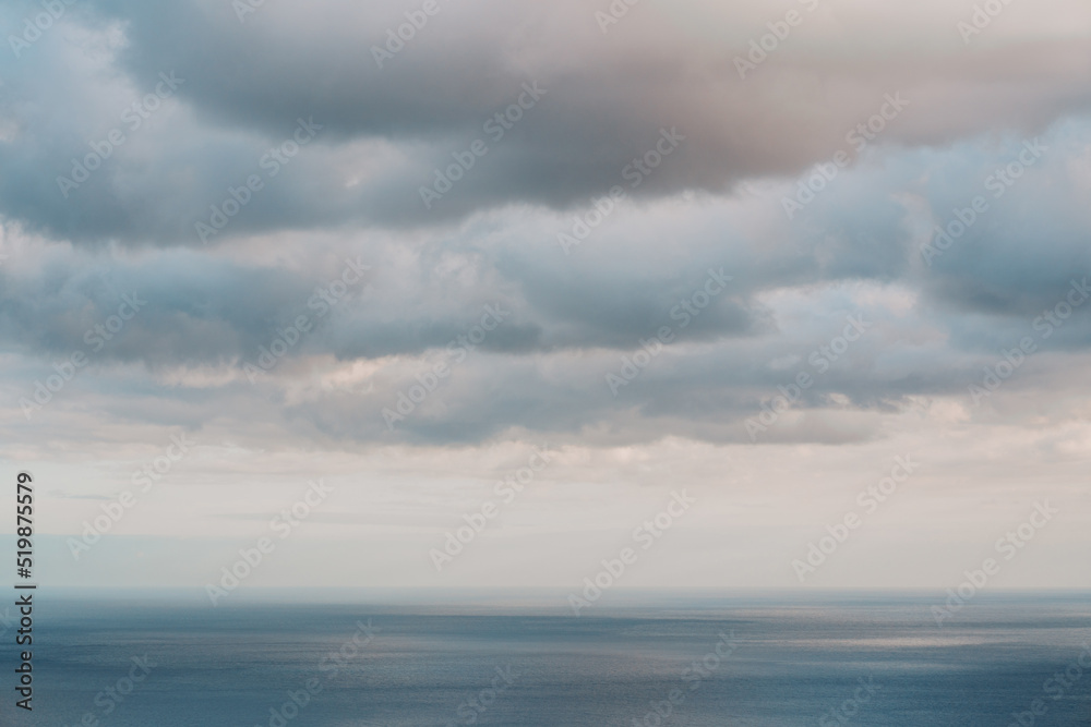Dreamy seascape with clouds over the sea