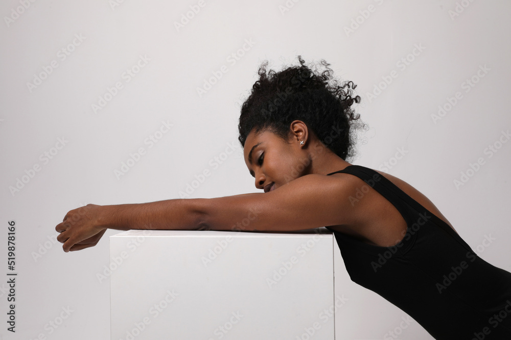 Portrait of African American young woman posing in the studio. Mock-up. Portrait of African American young woman posing in the studio. Mock-up.