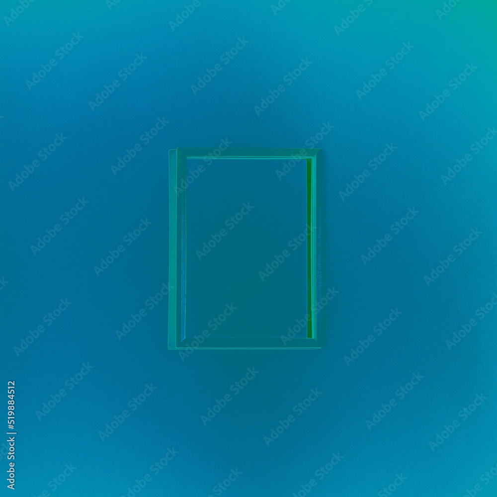 A picture frame on a blue background. Flat lay concept. A picture frame on a blue background. Flat lay concept.
