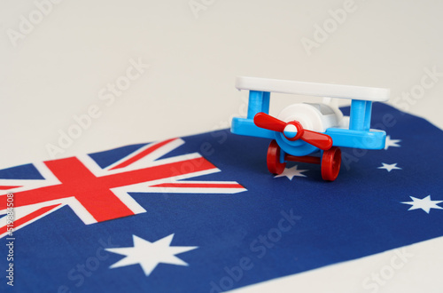 A toy plane stands on the flag - Australia.