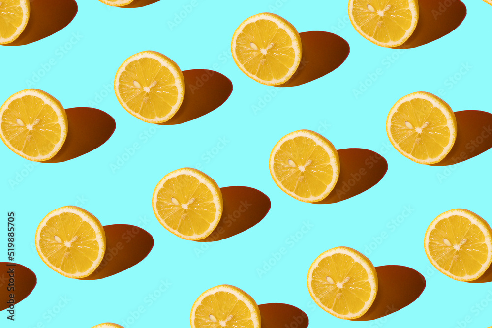Lemon pattern on a light blue background. Pop art design, creative citruses. Yellow lemon, minimal flat style. Lemon pattern on a light blue background. Pop art design, creative citruses. Yellow lemon, minimal flat style.