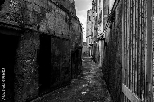 An empty path with old derelict houses in the center of Gargano  Italy