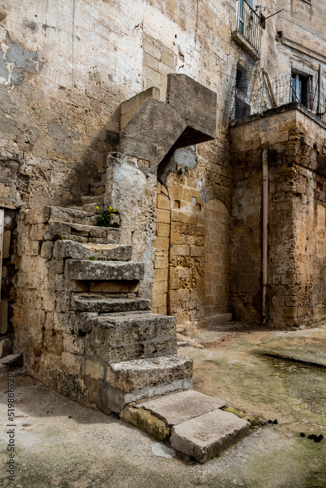 An old damaged staircase in downtown Gravina, Italy