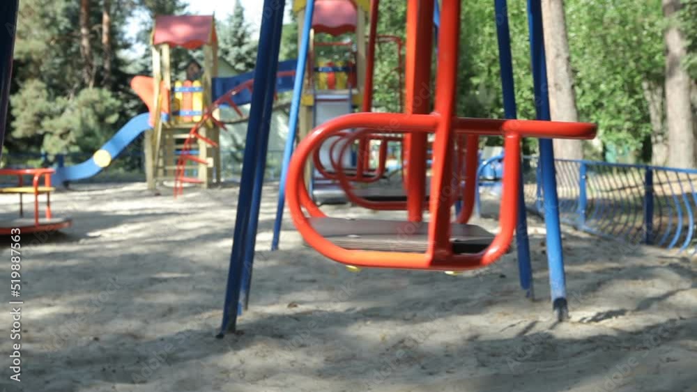 Empty swings in the playground Empty swings in the playground