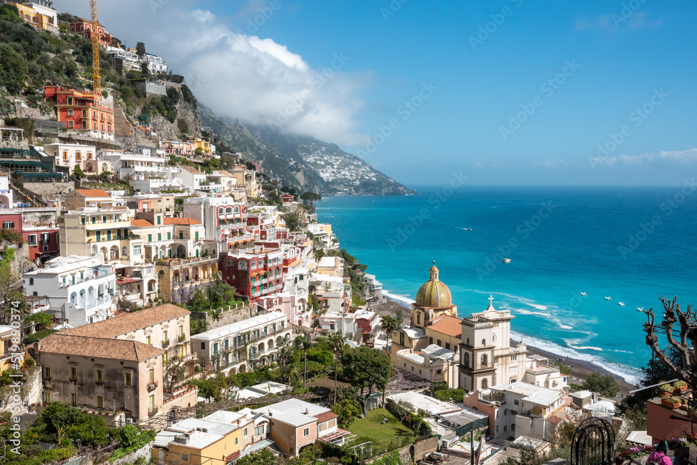 Cityscape of Positano at the Amalfi coast and the church Santa Maria Assunta, Italy