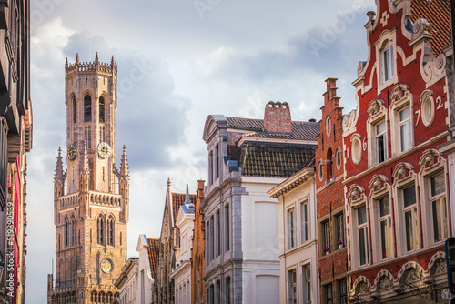 Belfry tower and flemish architecture in Bruges at sunny day, Belgium