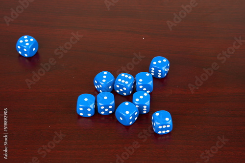 rolled 6-sided dice isolated on Mahagony background  photo