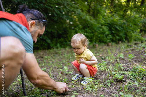 Young Caucasian father teaches his daughter about flora and fauna. Spending the day in nature © Stock Rocket