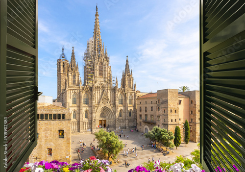 Photography View through an open window from across the plaza of the gothic Barcelona Cathedral in the El Born Gothic Quarter of the Catalonian city of Barcelona, Spain