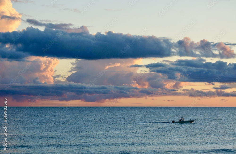 Fishing Boat Returning to Port Along Florida Gulf Coast at Sunset