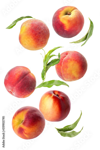 Flying ripe peaches on white background