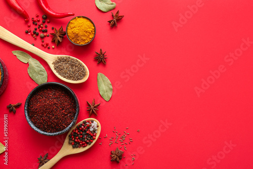 Fototapeta Naklejka Na Ścianę i Meble -  Composition with aromatic spices on red background